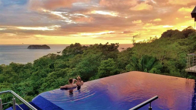 Couple enjoying private moments in a romantic swimming pool at sunset, the best time for a peaceful and intimate escape in Costa Rica