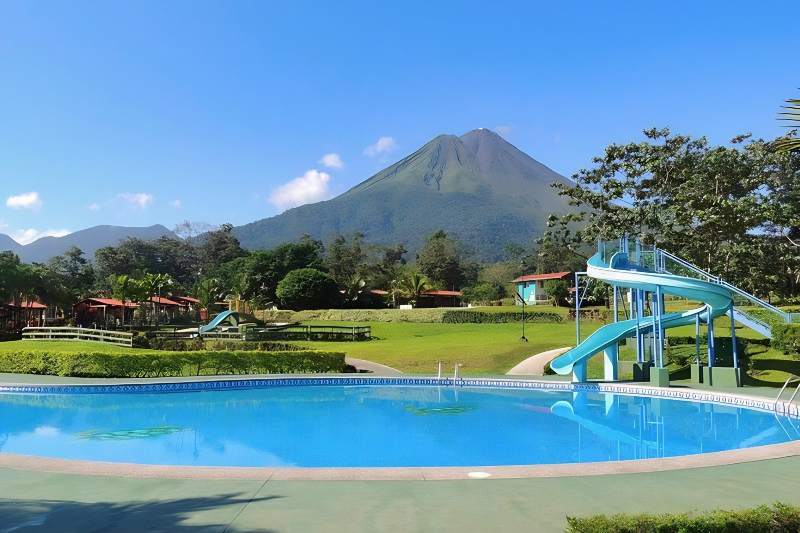 One of the chlorinated pools with a water slide at Los Laureles Hot Springs
