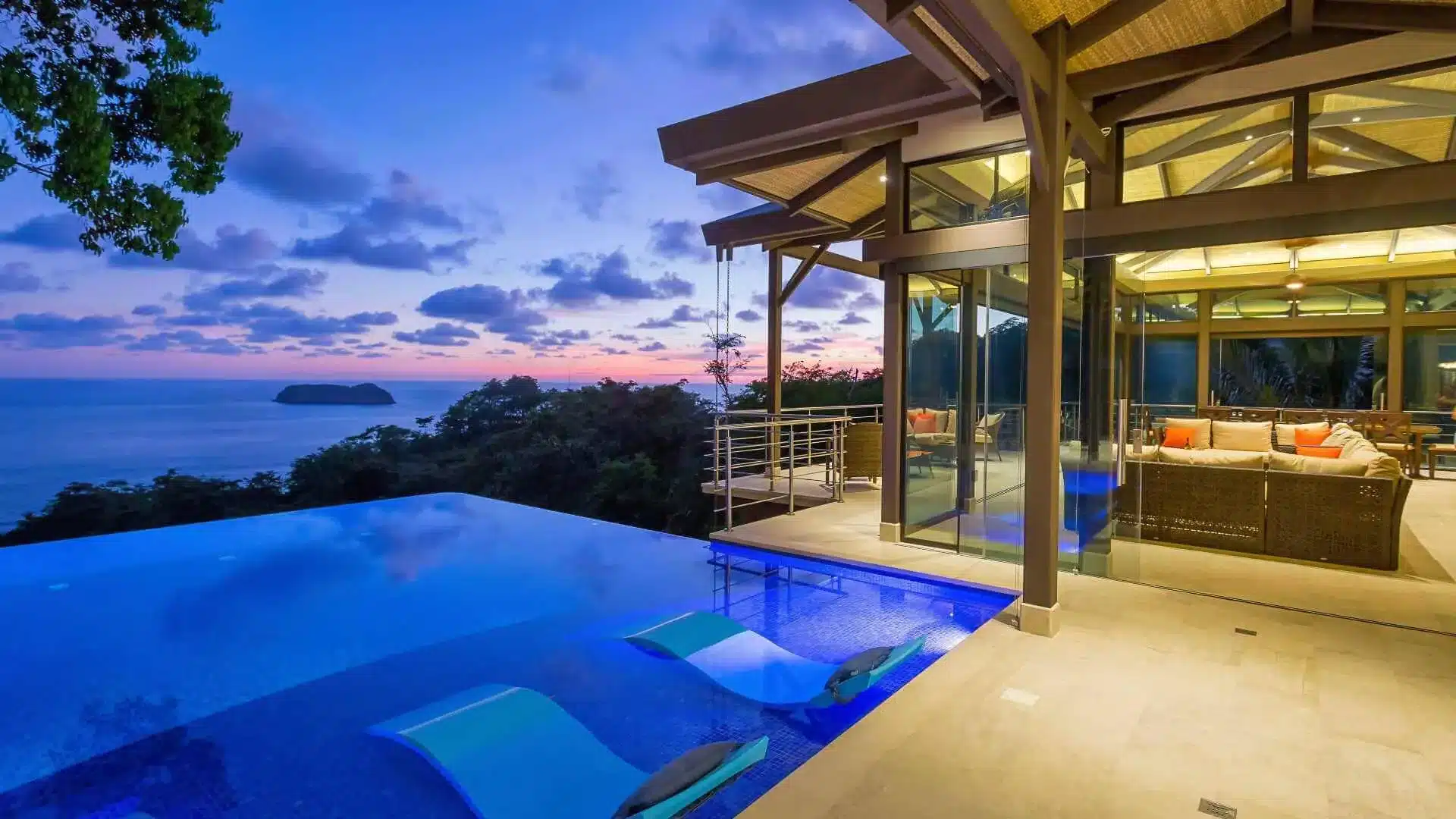 Dusk view of the infinity pool and top-level lounge at Costa Rica villa Vista Hermosa Estate in Manuel Antonio